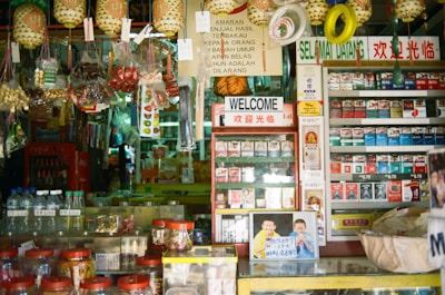 A warm, inviting storefront of Valai Guru Super Market bustling with customers.