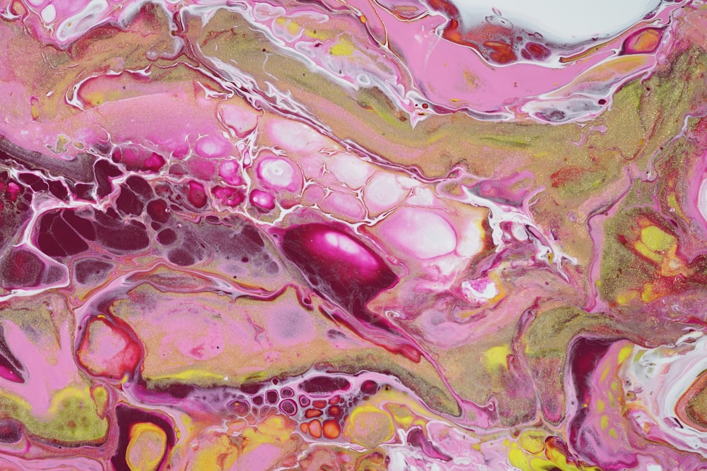 an abstract painting of pink and yellow colors