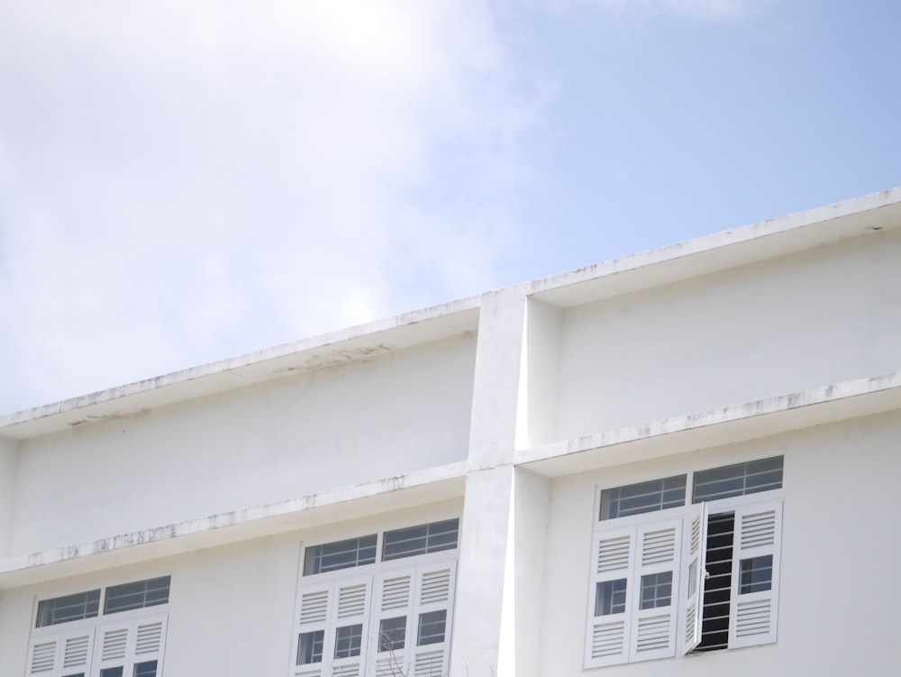 white concrete building under blue sky during daytime