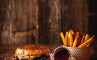 burger and fries on white ceramic plate