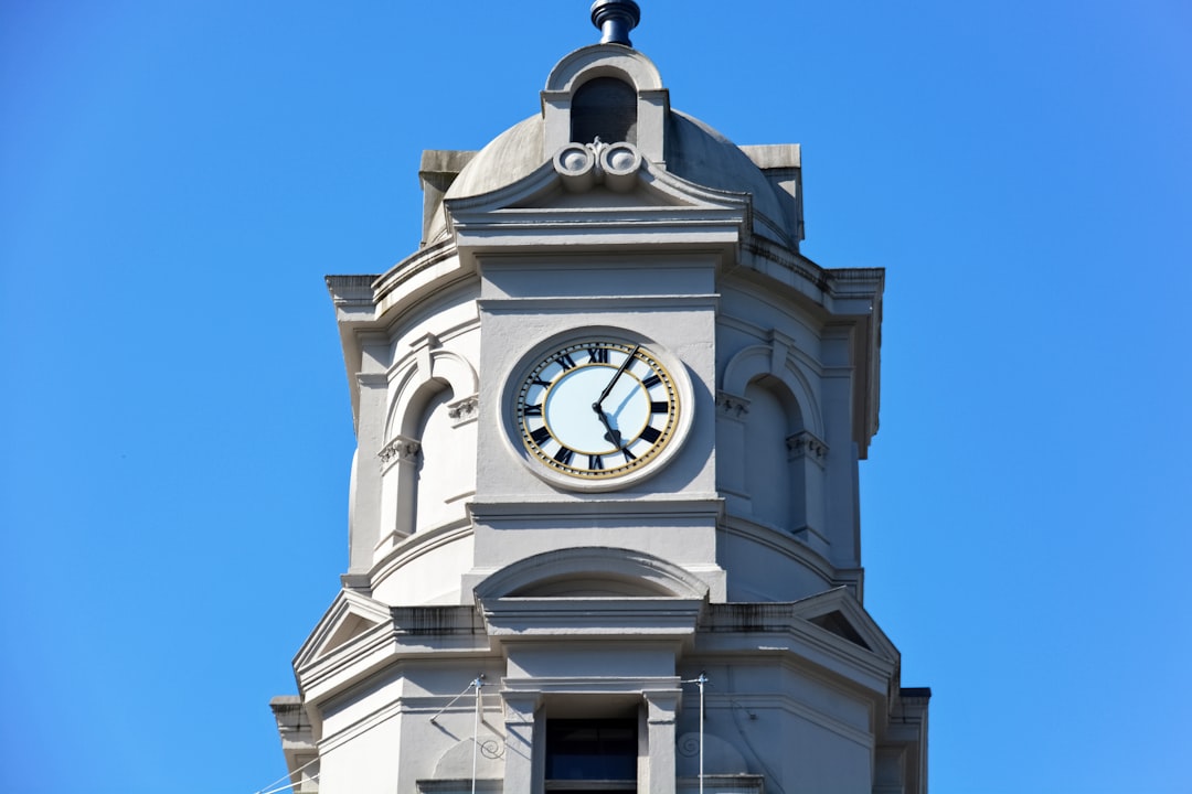 white concrete tower with clock