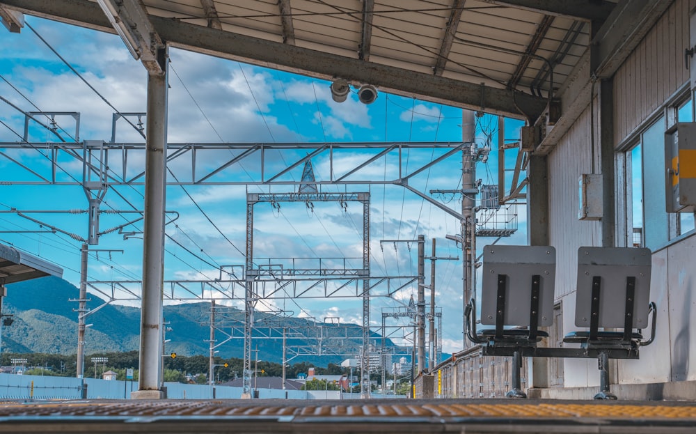 white and blue train on rail tracks during daytime