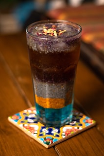 clear drinking glass with ice cubes and ice cubes