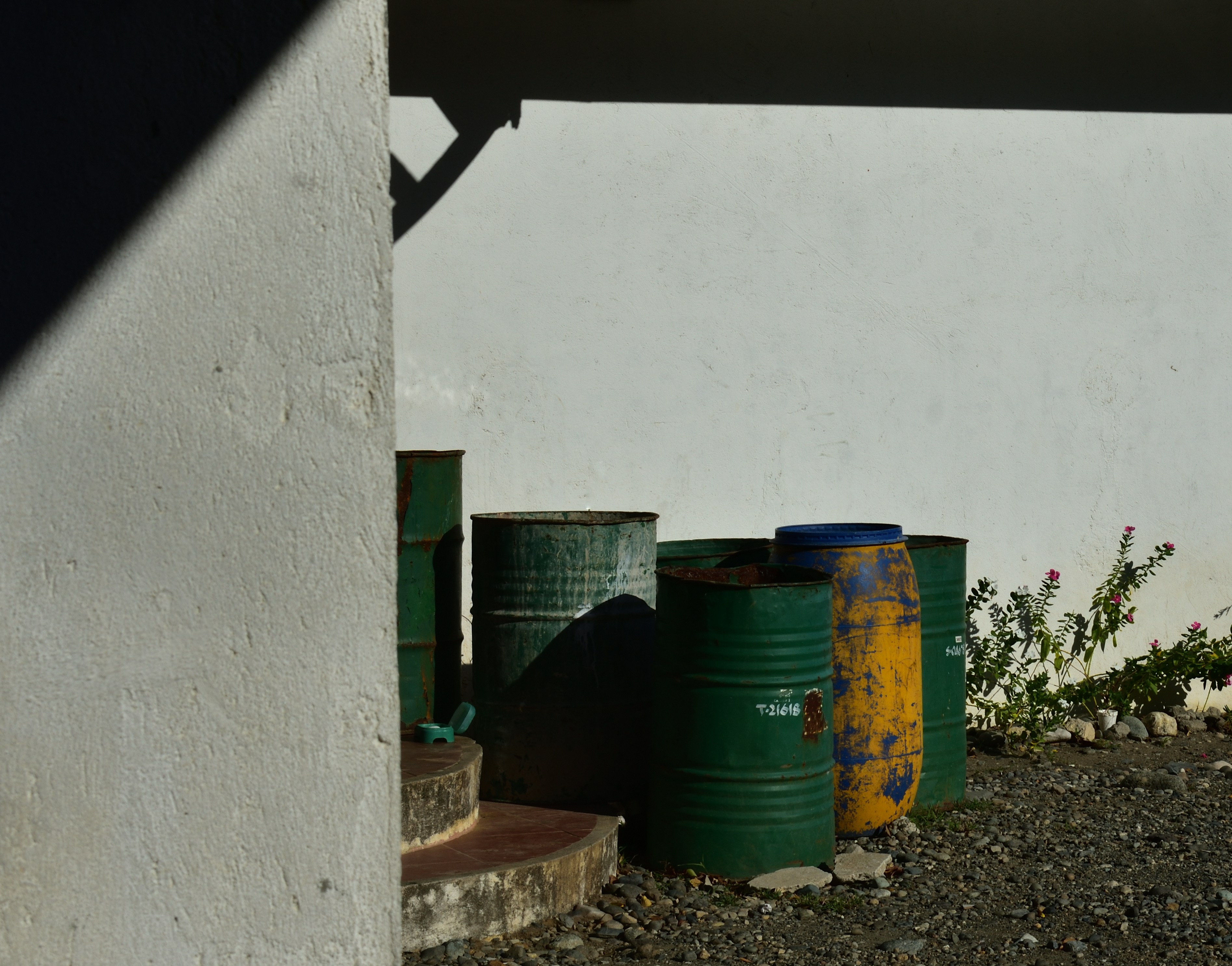 blue and green plastic barrels