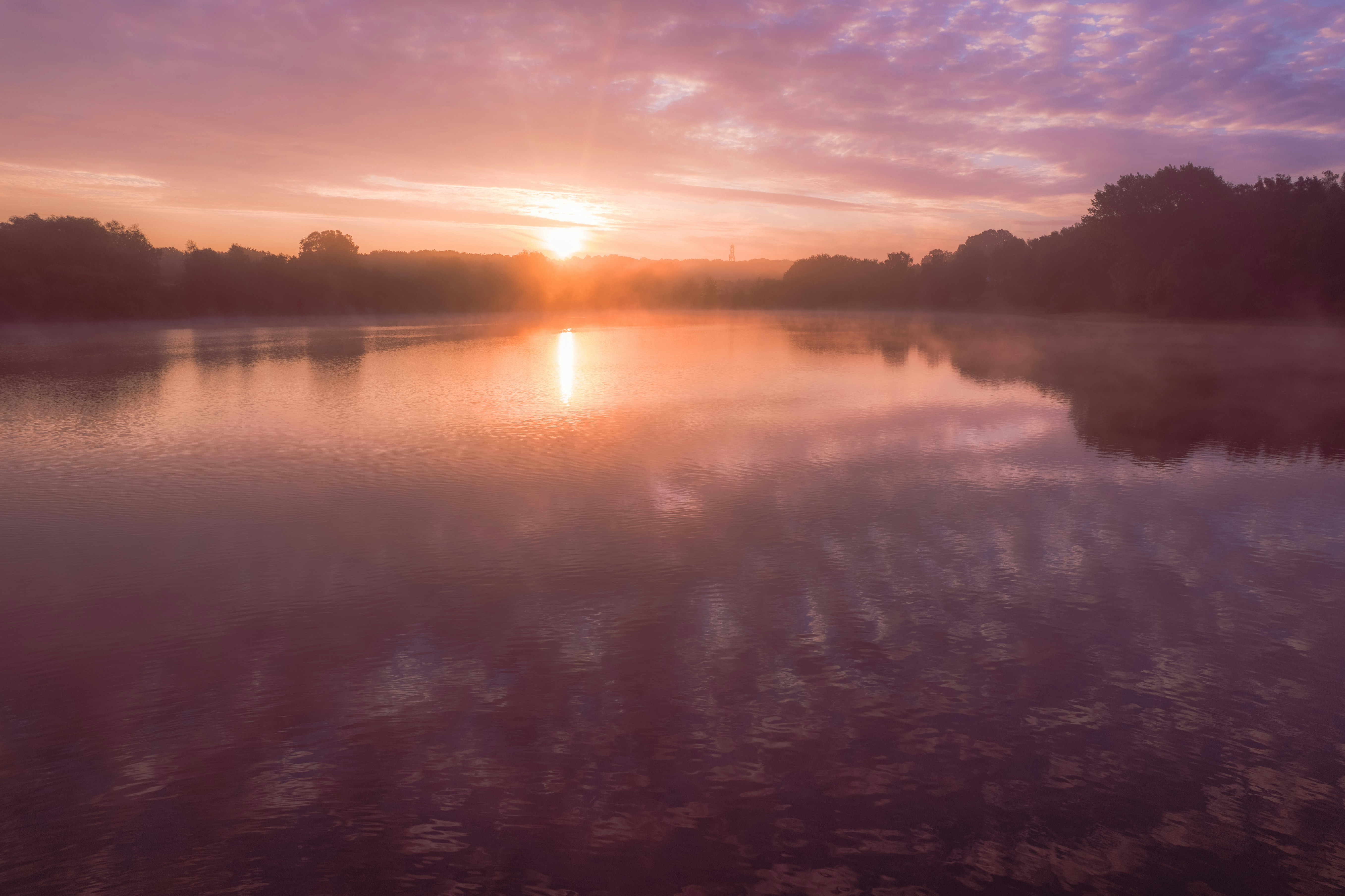 body of water during sunset