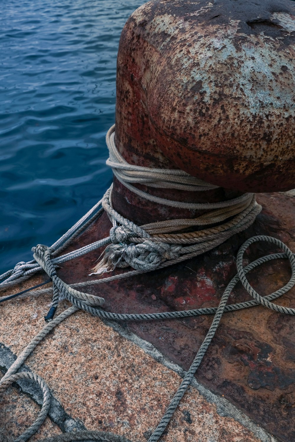 brown rope tied on brown wooden post