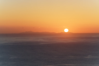 body of water during sunset