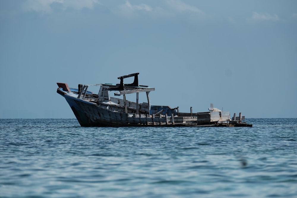 black and white ship on sea during daytime