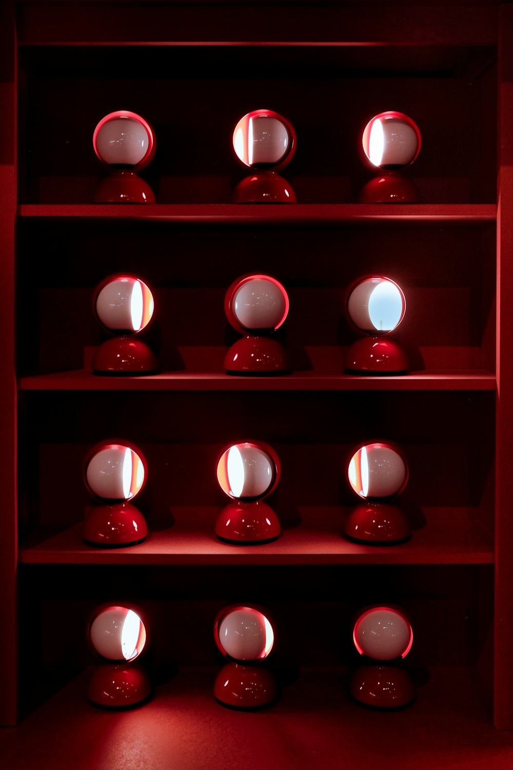 red and white baubles on red wooden shelf