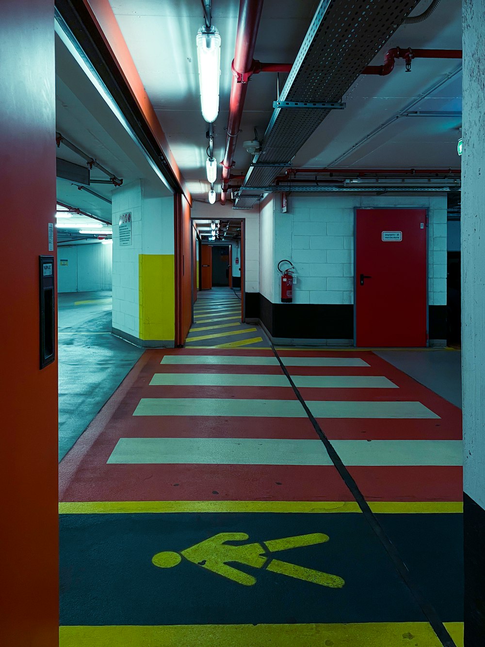 red and yellow hallway with red and yellow floor tiles