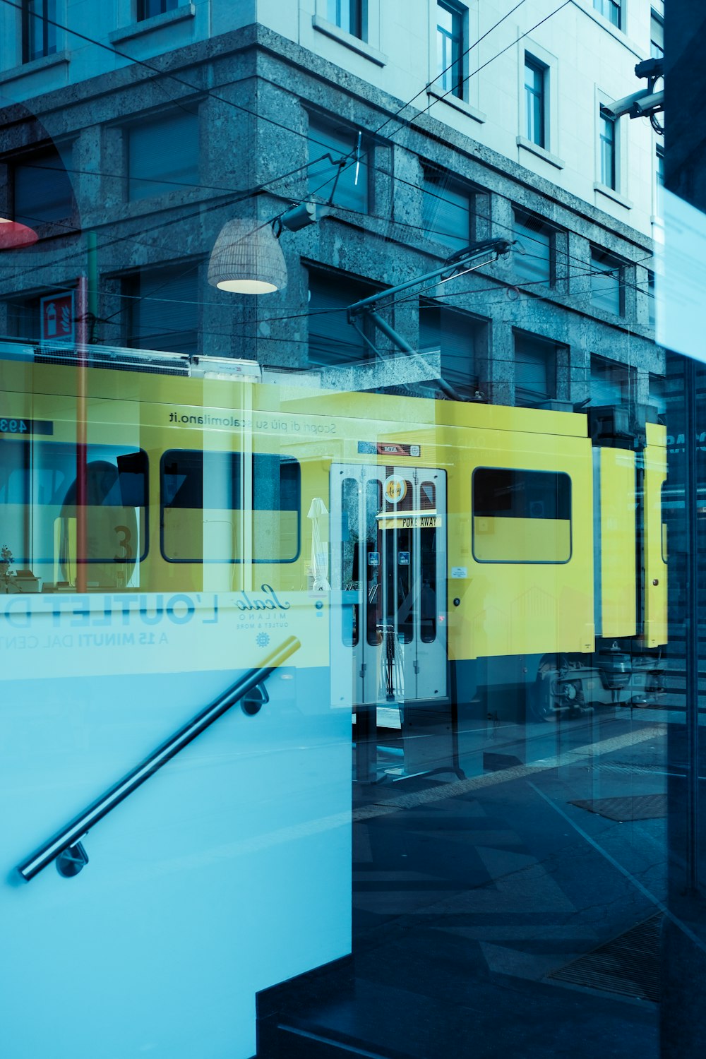 white and yellow train in train station