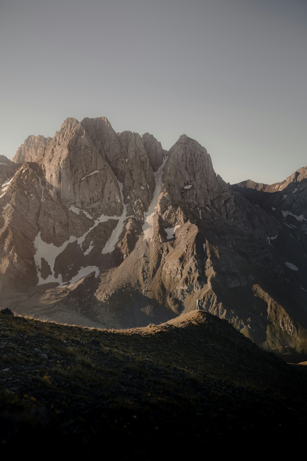 brown rocky mountain under white sky during daytime