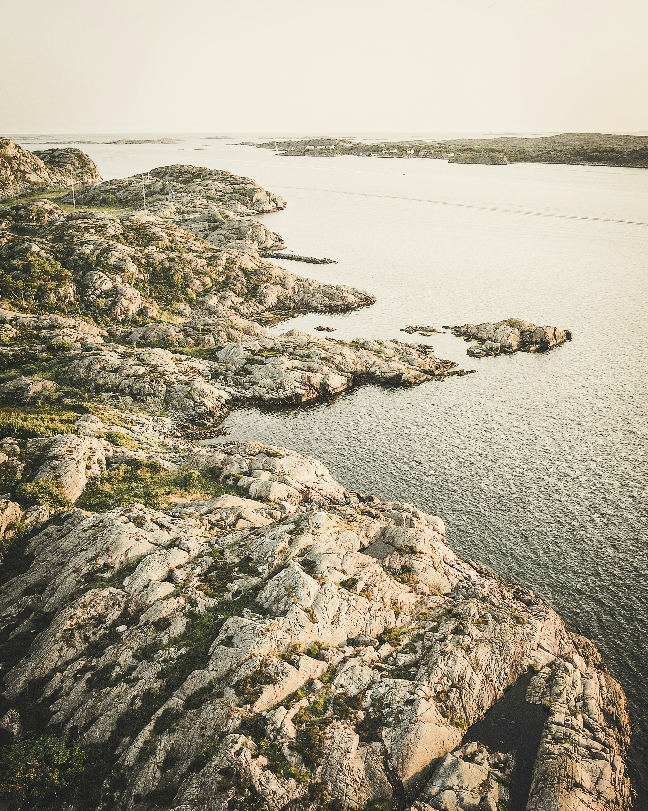 gray rock formation near body of water during daytime