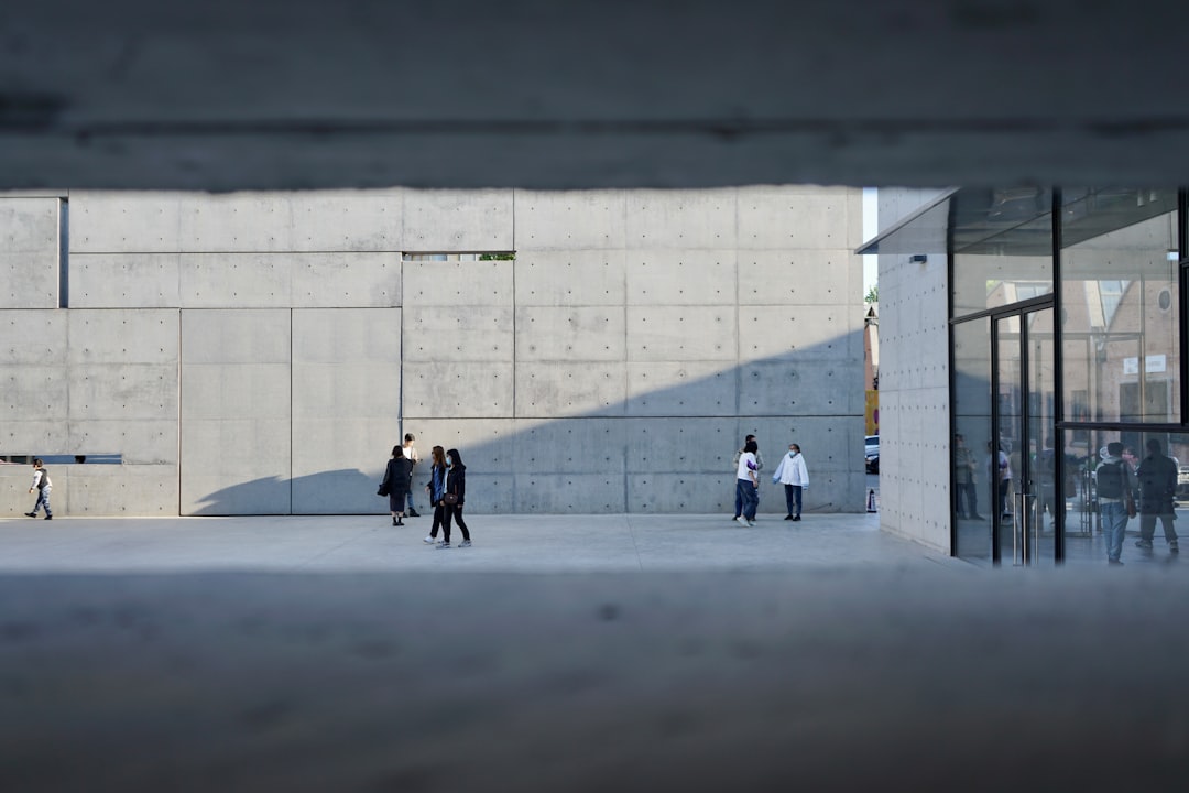 people walking on gray concrete floor