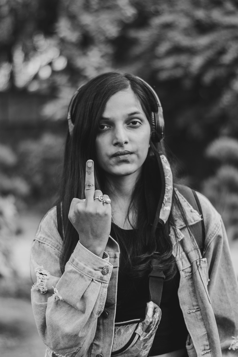 woman in jacket holding phone