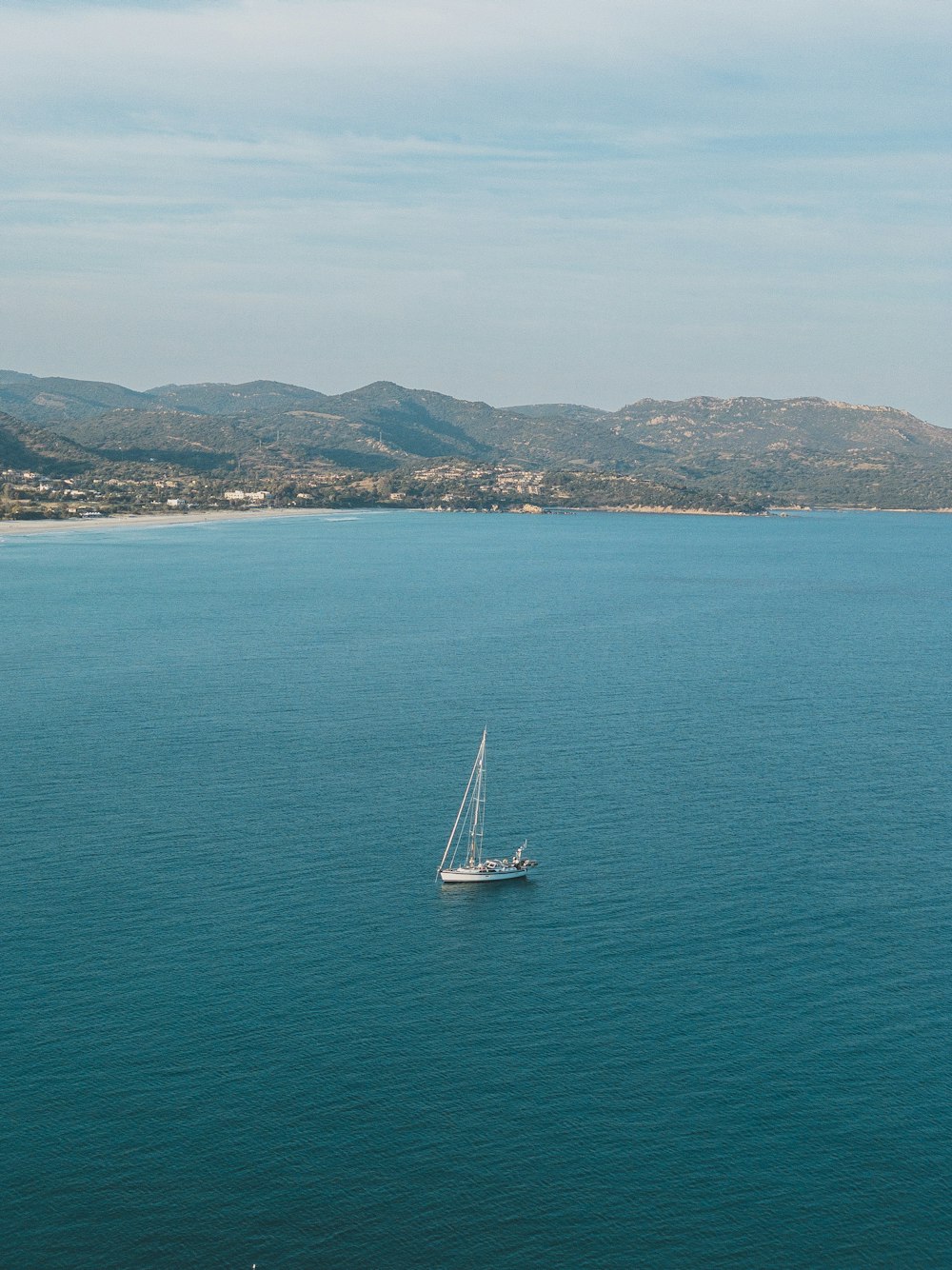 white sailboat on sea during daytime