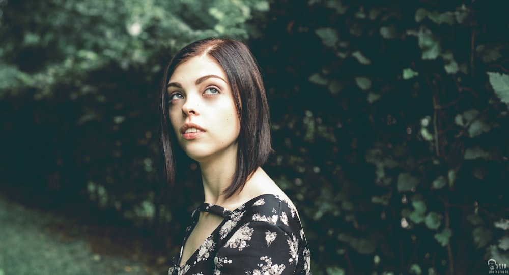 woman in black and white floral shirt