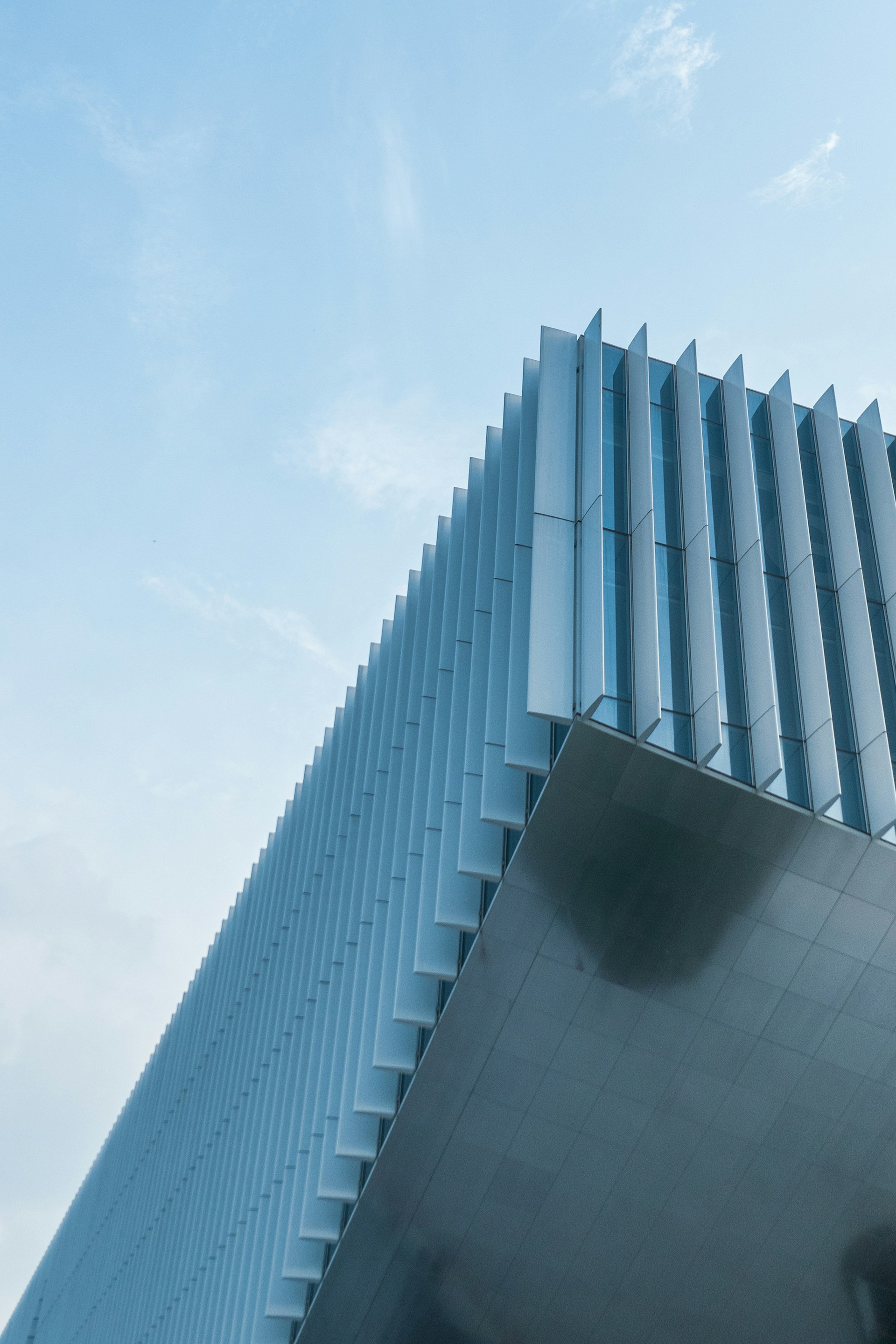white concrete building under white sky during daytime