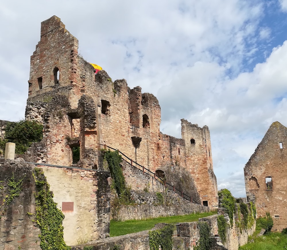 brown concrete castle under white clouds during daytime