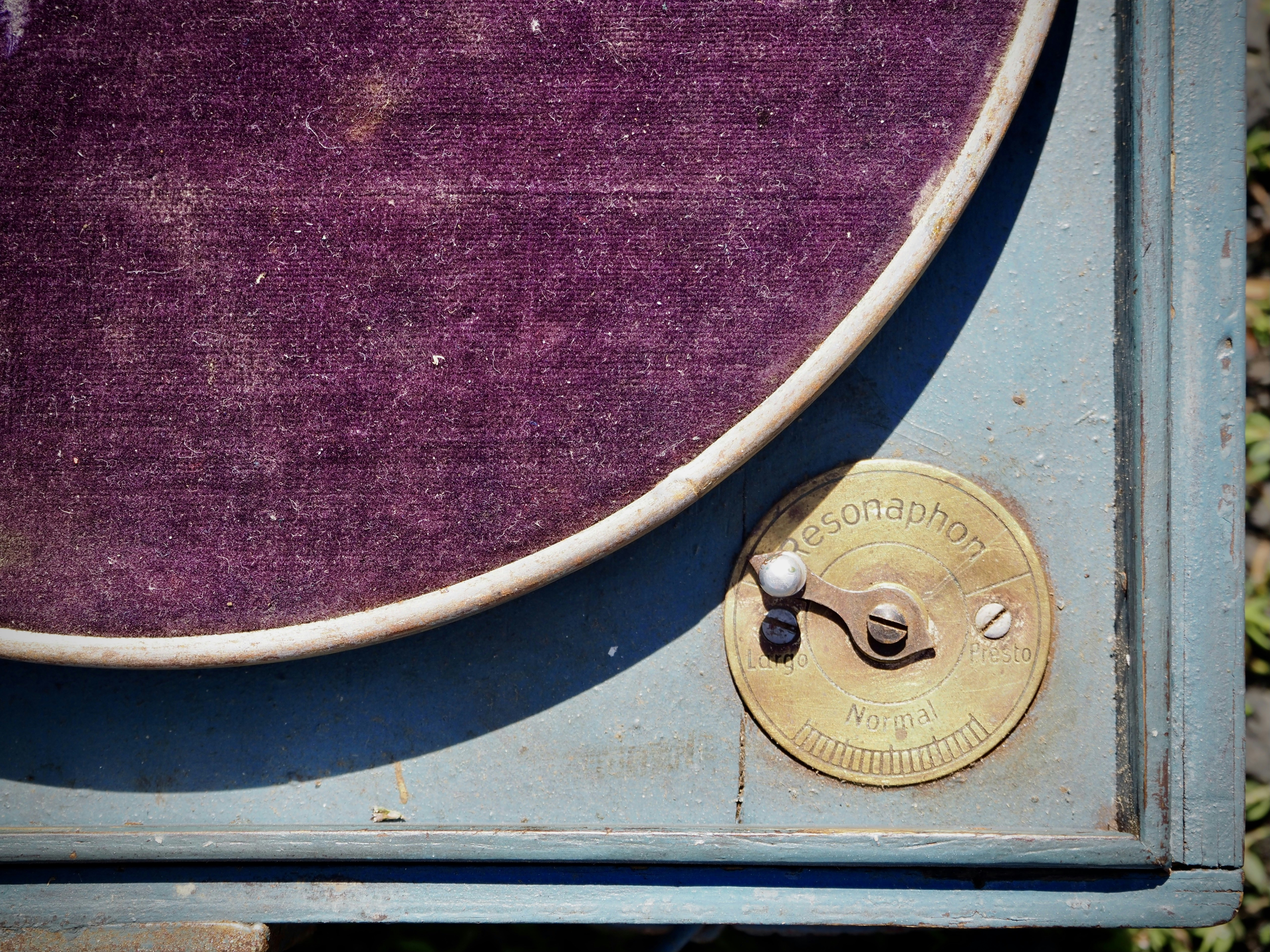 brass round door knob on purple textile