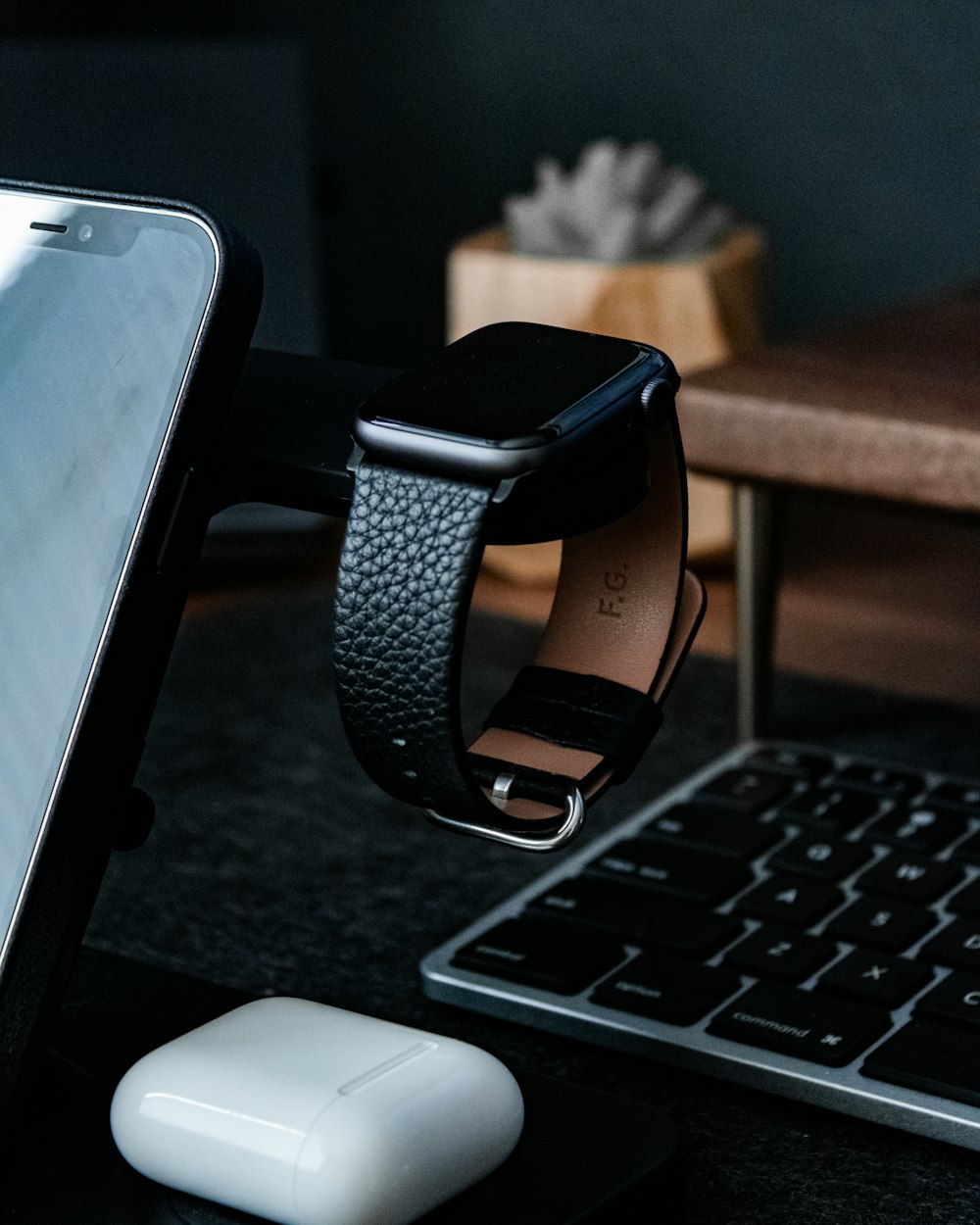 black and silver smart watch on macbook pro