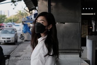 woman in white shirt wearing black sunglasses
