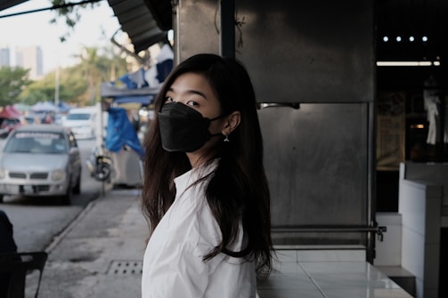 woman in white shirt wearing black sunglasses
