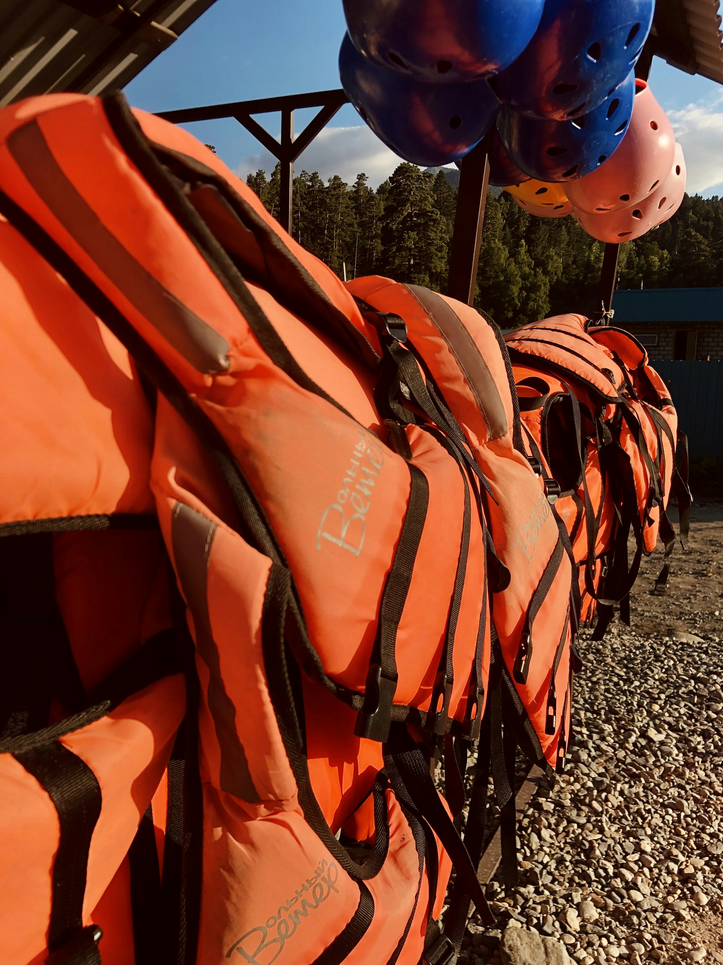 Orange immersion survival suit hanging on a rack