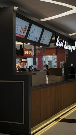 woman in black shirt sitting on chair