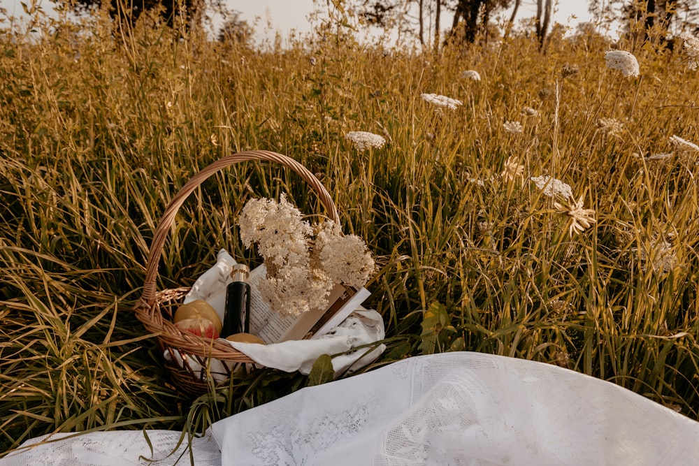 white flowers on brown woven basket