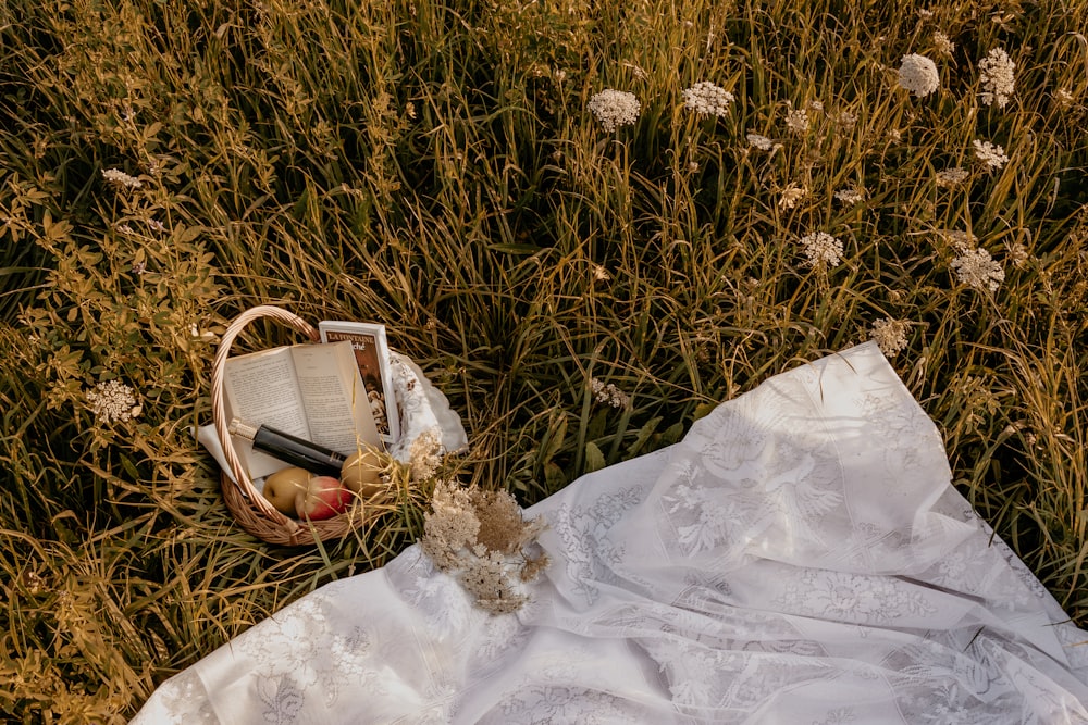 brown woven basket on white textile