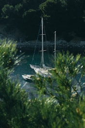 white boat on body of water during daytime