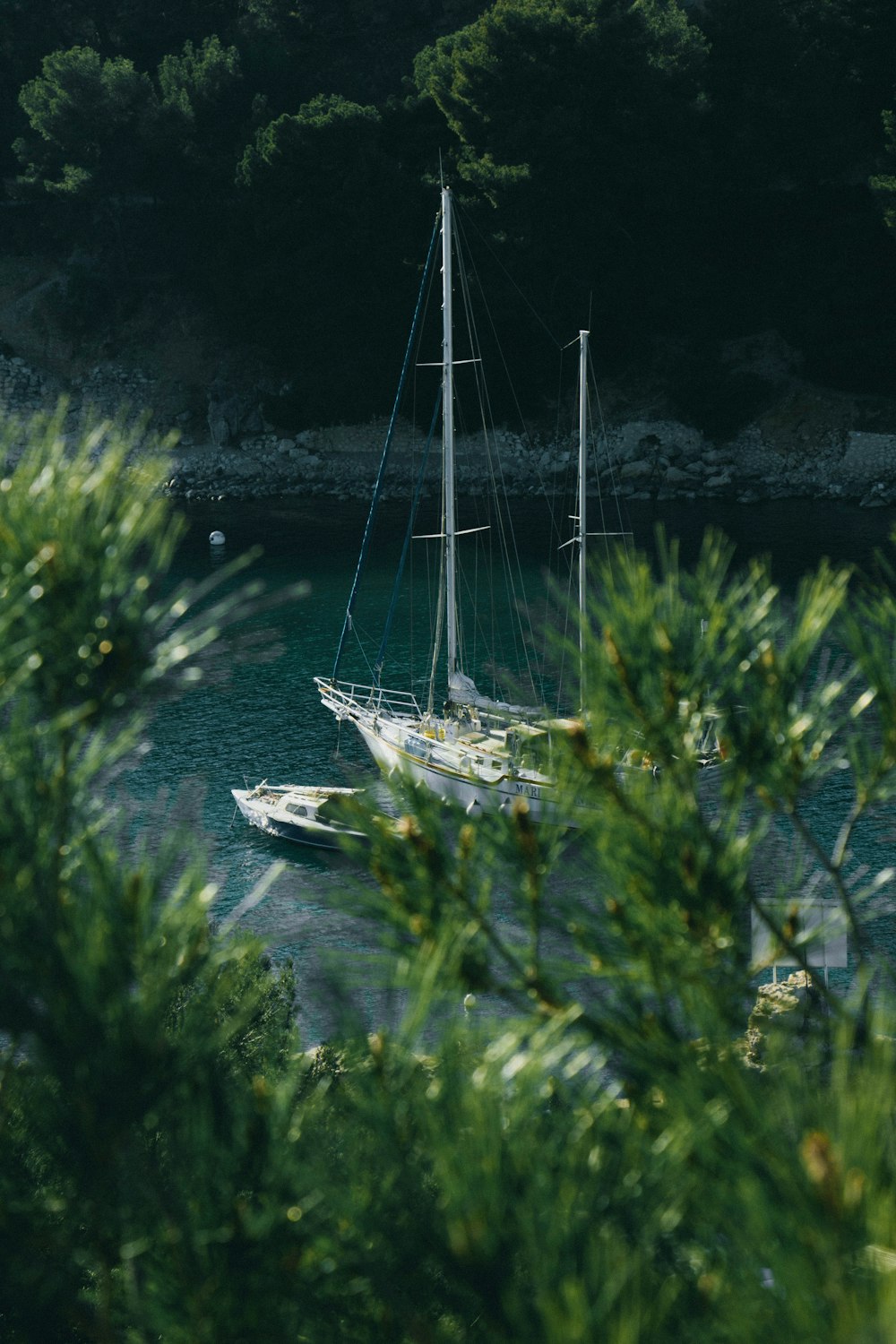 white boat on body of water during daytime