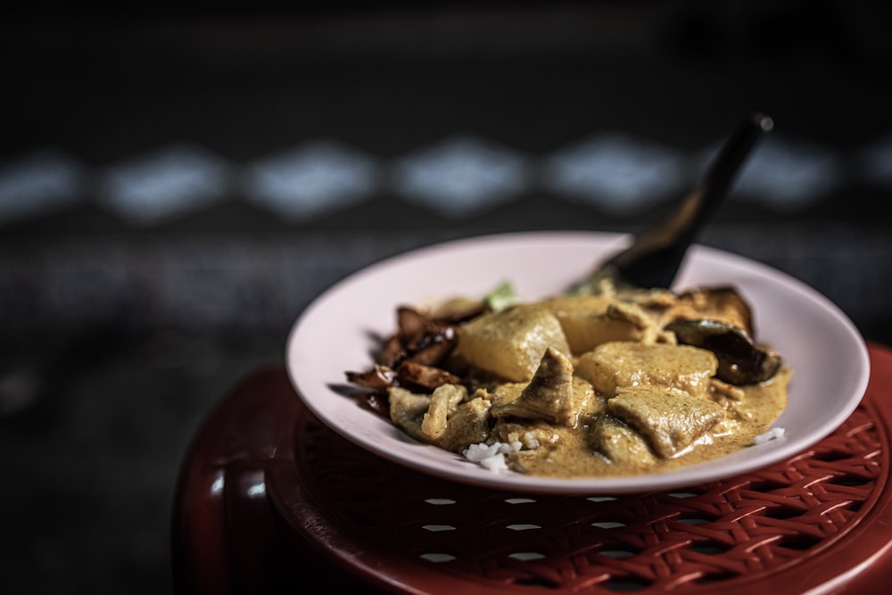 brown and white ceramic bowl with brown food