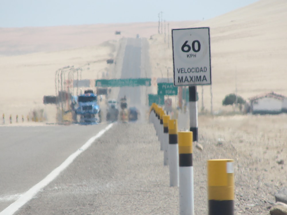 white and black road sign