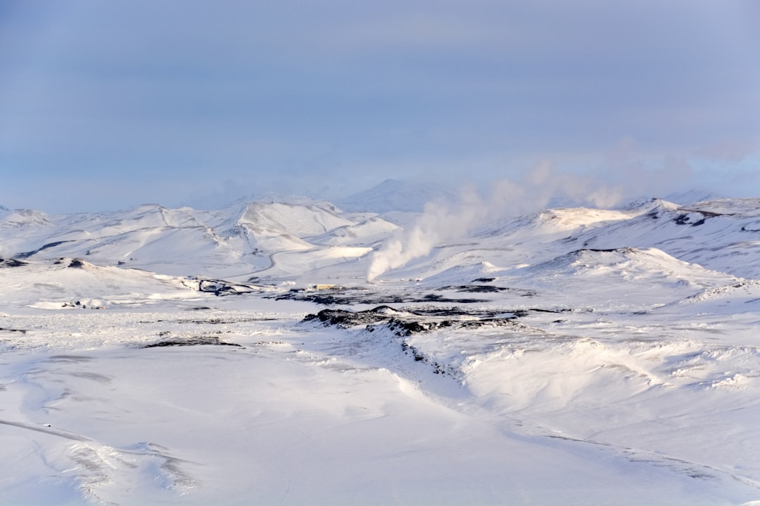 snow covered mountains under blue sky during daytime