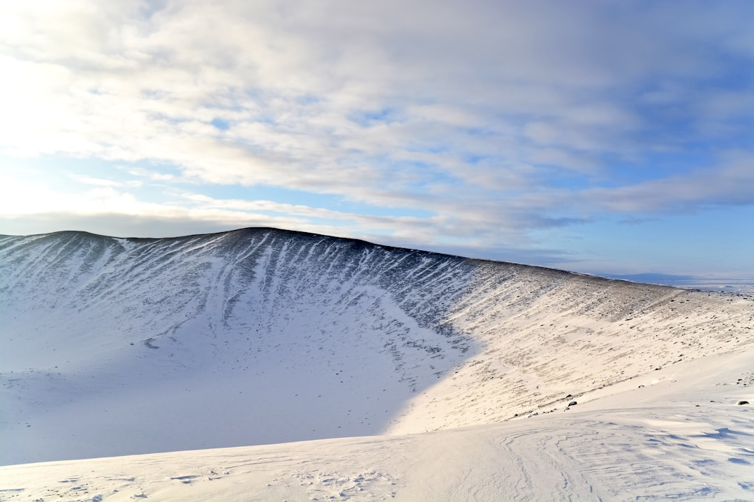 white sand under white clouds during daytime