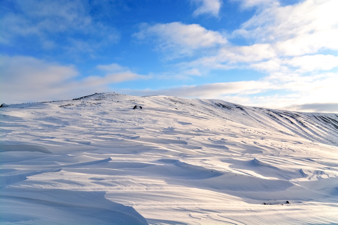 white snow covered mountain under blue sky during daytime