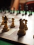 brown chess piece on chess board
