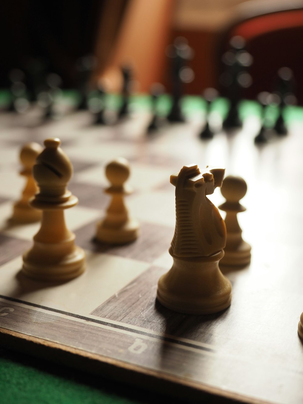 brown chess piece on chess board