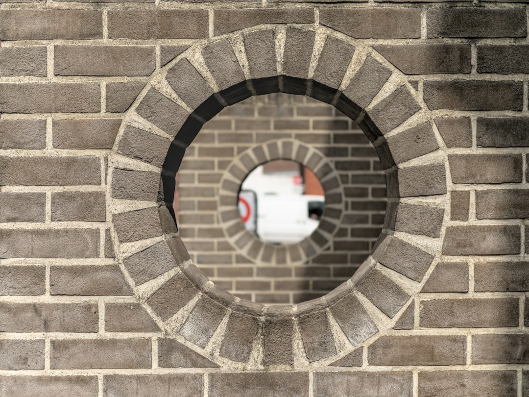 brown brick tunnel with hole