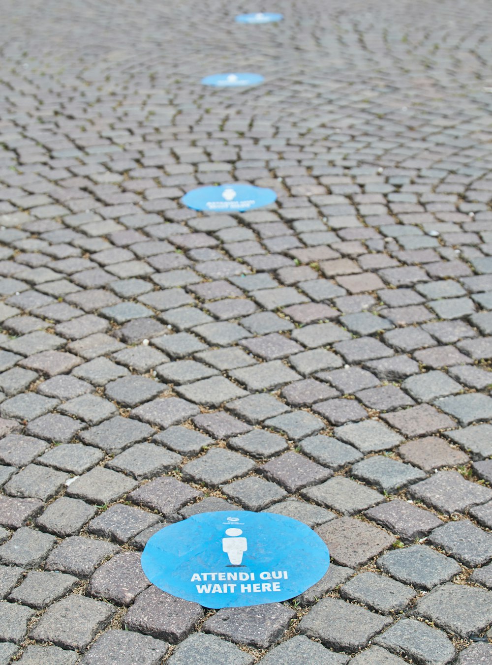 blue and white heart shaped plastic on brown brick floor