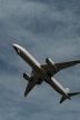 white passenger plane in mid air during daytime