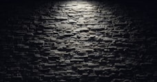 a black and white photo of a brick wall