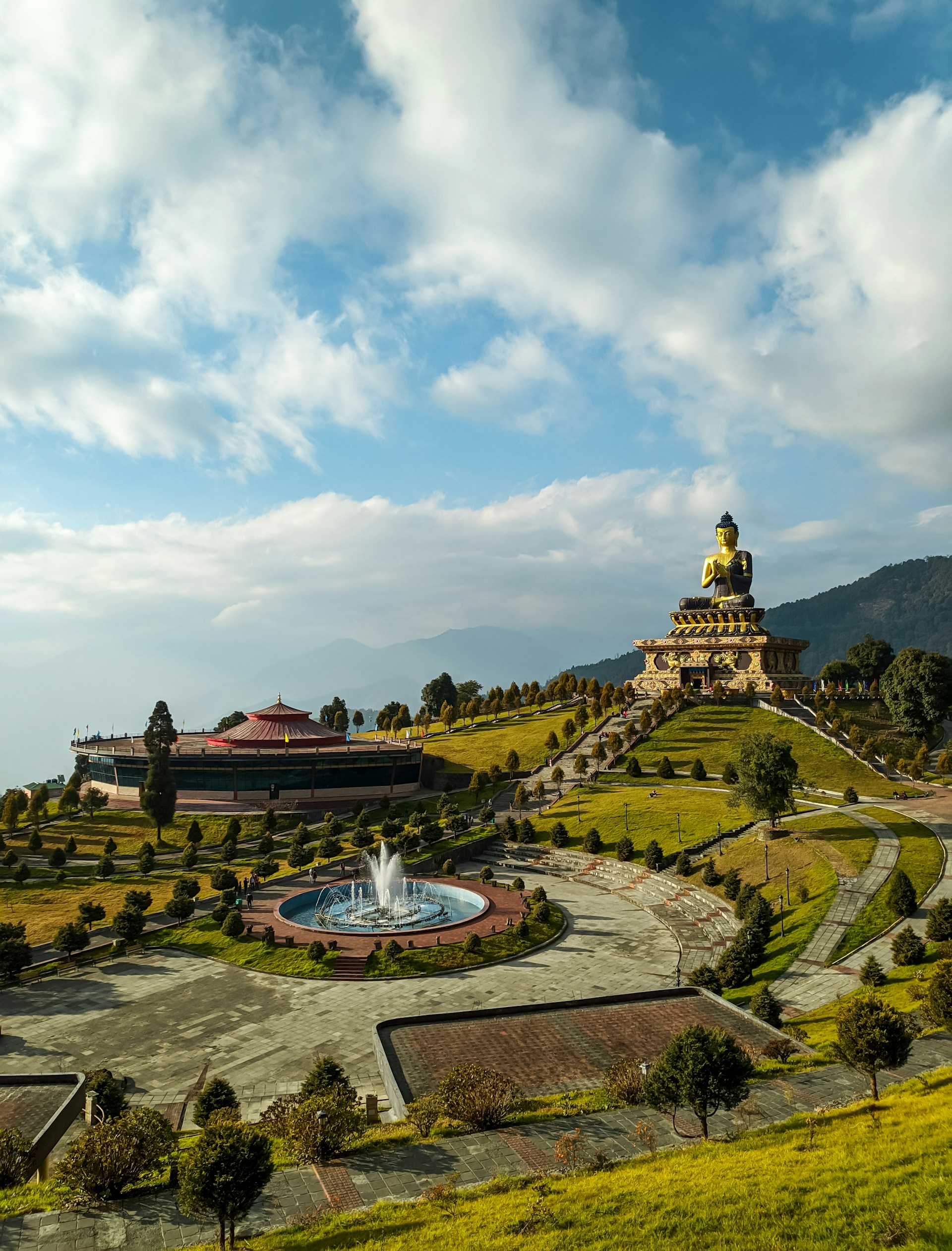 green and brown temple under white clouds during daytime