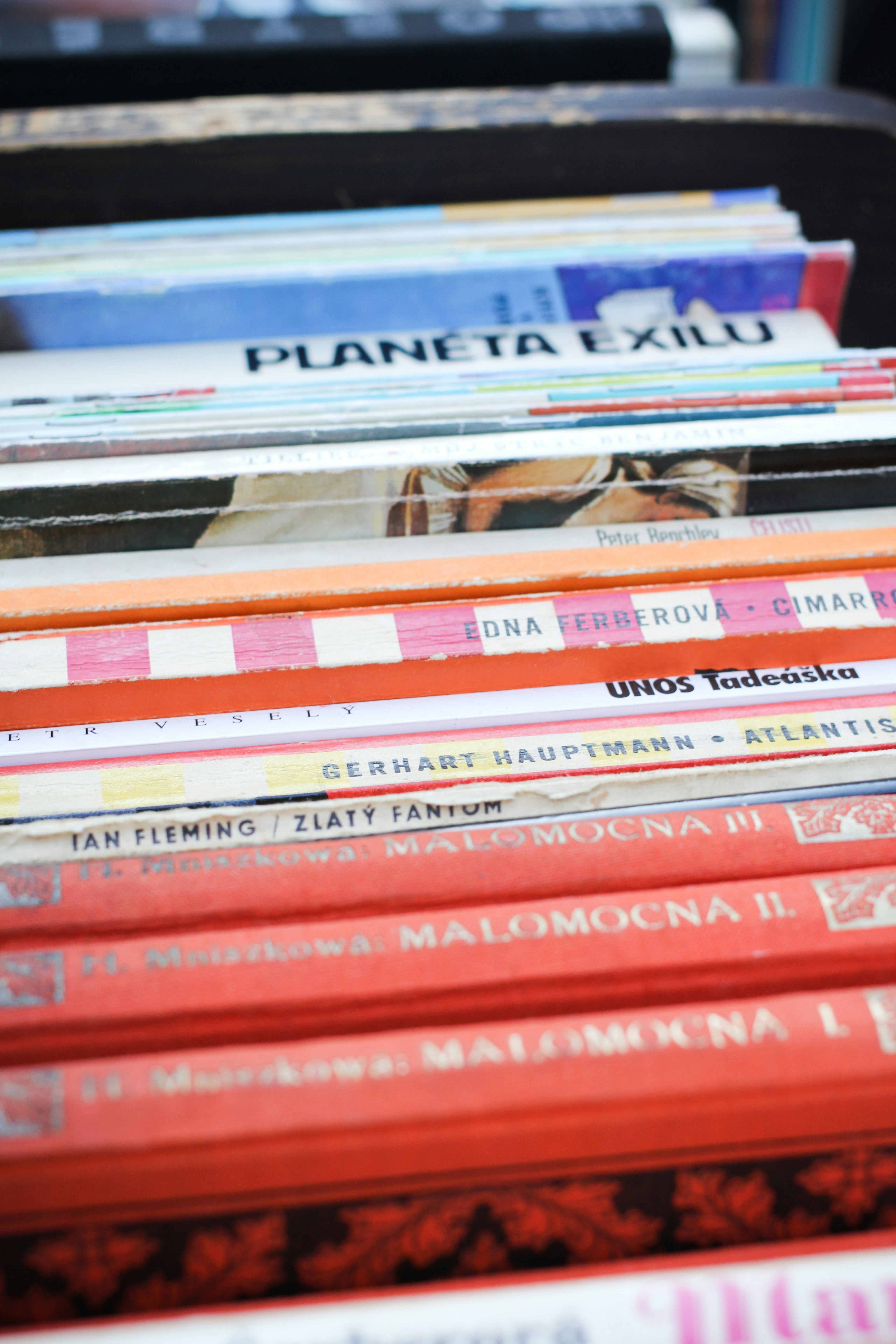 A bookshelf with books in various languages.