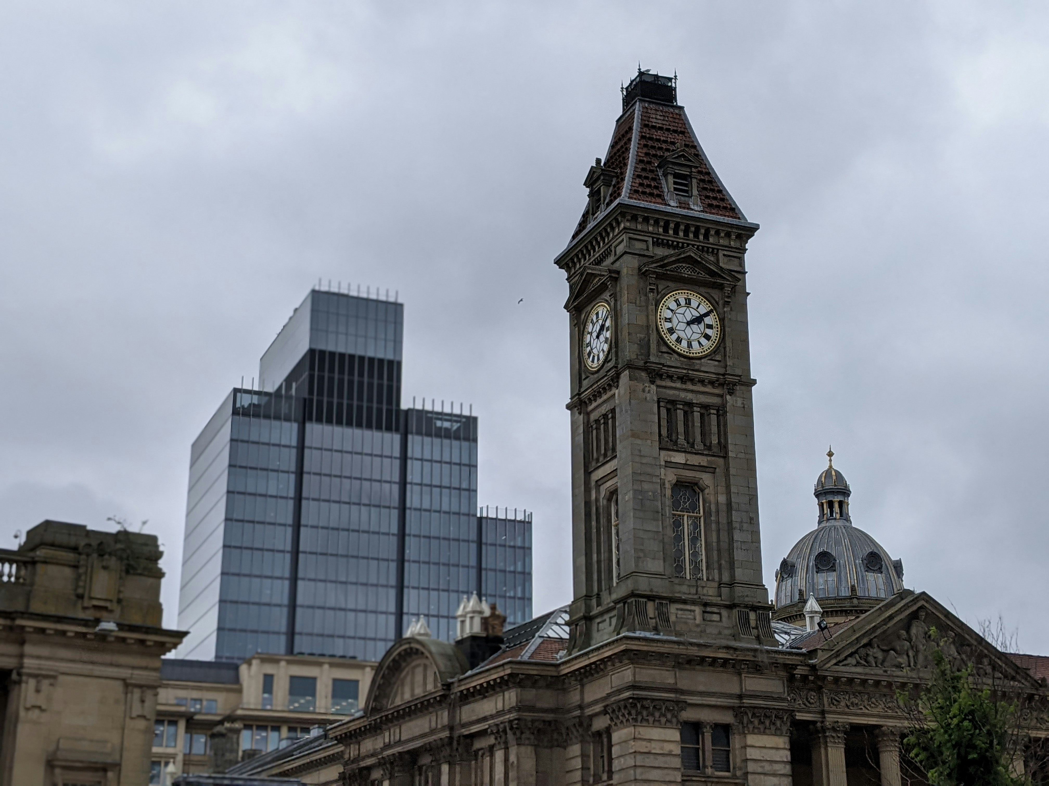 Clock tower at Birmingham Museum \u0026 Art Gallery with 103 Colmore Row in the background.