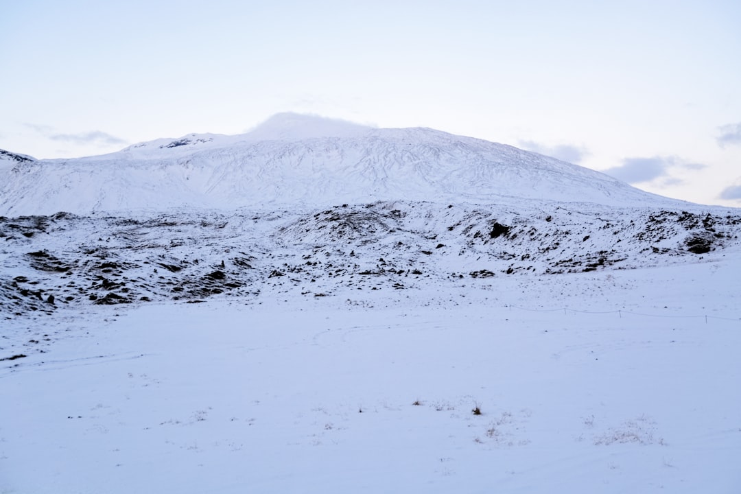 snow covered mountain during daytime