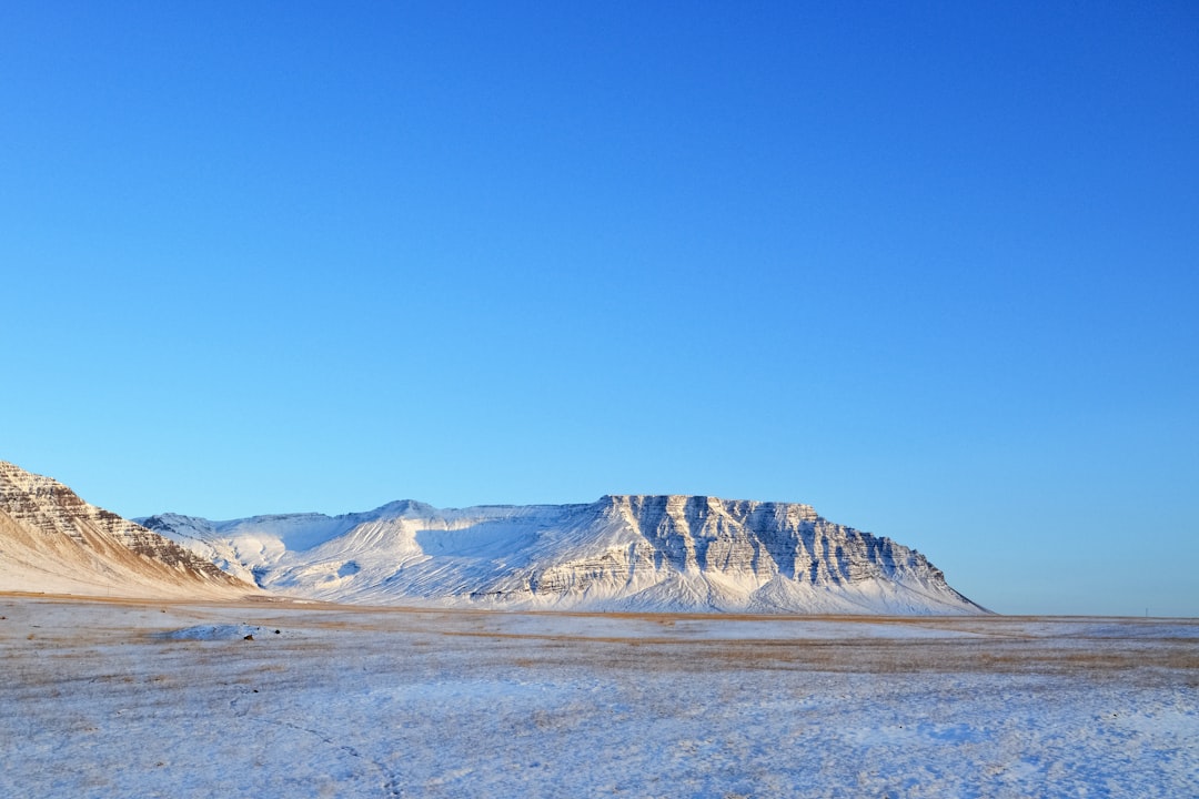 brown and white mountain under blue sky during daytime