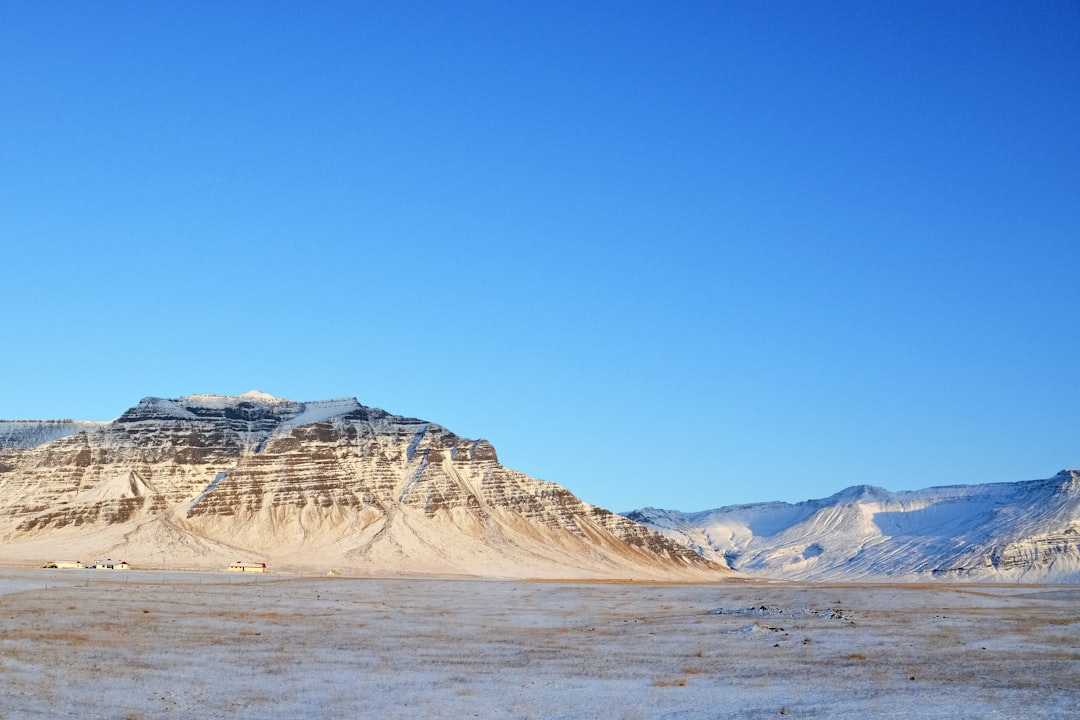 brown and white mountain under blue sky during daytime